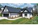 Attractive home boasts a well-kept lawn, white brick, a two car garage, and pleasing curb appeal at 4210 Holly Ne Cir, Conover, NC 28613