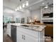 The kitchen features a granite countertop island and a stainless steel sink at 4210 Holly Ne Cir, Conover, NC 28613