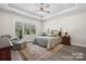 Comfortable main bedroom with a large window and soft carpet flooring at 4210 Holly Ne Cir, Conover, NC 28613