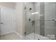 Walk-in shower with glass door and decorative tile at 4210 Holly Ne Cir, Conover, NC 28613