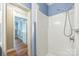 Bathroom featuring a shower, blue walls, and white trim at 4699 Cherrystone Rd, Lancaster, SC 29720