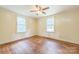 Bedroom features a ceiling fan and natural light streaming through two windows, perfect for renovation at 4699 Cherrystone Rd, Lancaster, SC 29720