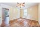 View of a bedroom with original hardwood floors and ceiling fan, ready for personal touches at 4699 Cherrystone Rd, Lancaster, SC 29720