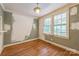 Dining room with hardwood floors and natural light from large windows at 4699 Cherrystone Rd, Lancaster, SC 29720