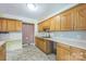Kitchen with wooden cabinets, laminate counters, and tiled floors at 4699 Cherrystone Rd, Lancaster, SC 29720