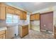 Kitchen featuring wooden cabinets, laminate counters, and neutral flooring at 4699 Cherrystone Rd, Lancaster, SC 29720