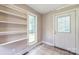 Laundry room with tile floors, window and shelving at 4699 Cherrystone Rd, Lancaster, SC 29720