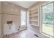Functional laundry room featuring tile flooring and built-in shelving at 4699 Cherrystone Rd, Lancaster, SC 29720