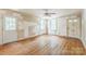 Bright living room featuring hardwood floors, two windows, and two doors at 4699 Cherrystone Rd, Lancaster, SC 29720
