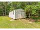 Detached storage shed with double doors, providing ample space for tools and equipment at 4699 Cherrystone Rd, Lancaster, SC 29720