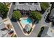 Aerial view of a townhome community with a pool and well-manicured landscaping, showcasing the community's layout at 4708 S Hill View Dr, Charlotte, NC 28210