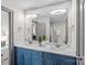 Bathroom features a double sink vanity with quartz countertops and modern fixtures at 4708 S Hill View Dr, Charlotte, NC 28210