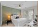 Cozy bedroom with a panel accent wall, soft lighting, and neutral finishes at 4708 S Hill View Dr, Charlotte, NC 28210
