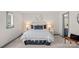 Inviting bedroom with stylish decor, including decorative pillows and bedside lamps, creating a relaxing ambiance at 4708 S Hill View Dr, Charlotte, NC 28210