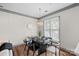 Bright dining room features a modern table, pendant lighting, and large window for natural light at 4708 S Hill View Dr, Charlotte, NC 28210
