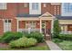 Inviting front porch of a brick townhouse, perfect for relaxing outdoors at 4708 S Hill View Dr, Charlotte, NC 28210
