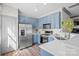 Charming kitchen featuring blue cabinets, stainless steel appliances, and bright white countertops at 4708 S Hill View Dr, Charlotte, NC 28210