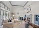 Bright living room features high ceilings, fireplace, and large windows at 4708 S Hill View Dr, Charlotte, NC 28210