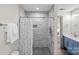 Walk-in shower boasts sleek, modern tilework and contemporary fixtures and hardware at 4708 S Hill View Dr, Charlotte, NC 28210