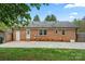Spacious brick home featuring a large patio and well-maintained lawn at 4932 Delivau Dr, Charlotte, NC 28215