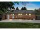 Home's backyard features a large concrete patio and a well-maintained lawn at 4932 Delivau Dr, Charlotte, NC 28215