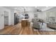 Bright living area with hardwood floors, neutral paint, modern ceiling fan, and furniture at 4932 Delivau Dr, Charlotte, NC 28215