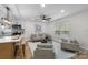 Bright living area with hardwood floors, neutral paint, modern ceiling fan, and furniture at 4932 Delivau Dr, Charlotte, NC 28215