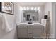 A modern bathroom with double vanity, bright lighting, decorative ladder, and elegant fixtures at 622 Station St # 48, Clover, SC 29710