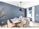 This dining room offers a stylish design, with a modern chandelier, and board and batten accent wall at 622 Station St # 48, Clover, SC 29710