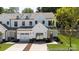 Charming, new construction townhome featuring a white exterior, garage and well-manicured lawn at 622 Station St # 48, Clover, SC 29710