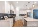 Bright kitchen featuring stainless steel appliances, kitchen island, and stylish pendant lighting at 622 Station St # 48, Clover, SC 29710