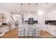 Bright kitchen featuring stainless steel appliances, kitchen island with bar stool seating and stylish pendant lighting at 622 Station St # 48, Clover, SC 29710