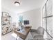 Office featuring a desk area, comfortable chair, shelving, and natural light at 622 Station St # 48, Clover, SC 29710