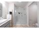 Modern bathroom showing glass enclosed tiled shower, niche, and decorative ladder towel rack at 622 Station St # 48, Clover, SC 29710