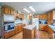 Functional kitchen boasts an island, ample wood cabinets, and modern appliances at 6785 Knotty Wood Ln, Vale, NC 28168