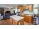 Functional kitchen featuring an island and lots of storage space with an open design to the living room at 6785 Knotty Wood Ln, Vale, NC 28168