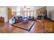 Inviting living room featuring a cozy fireplace, comfortable seating, and hardwood flooring at 6785 Knotty Wood Ln, Vale, NC 28168