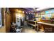 Inside view of a storage shed with wooden walls, illuminated by exposed lighting, creating a functional workshop space at 6785 Knotty Wood Ln, Vale, NC 28168
