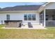 A backyard patio featuring a hot tub and a sun-bathing chair at 6907 Hunts Mesa Dr, Fort Mill, SC 29707