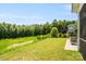 Backyard includes a hot tub, wooded area, and fenced area for pets at 6907 Hunts Mesa Dr, Fort Mill, SC 29707