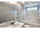 Bright bathroom features a tub-shower combo with white tile and a single-sink vanity at 6907 Hunts Mesa Dr, Fort Mill, SC 29707