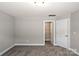 Bedroom with neutral carpet and paint leading to the walk-in closet at 6907 Hunts Mesa Dr, Fort Mill, SC 29707