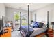 Stylish bedroom featuring a four-poster bed, window view, and dark wood accents at 6907 Hunts Mesa Dr, Fort Mill, SC 29707