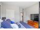 Bright bedroom featuring a decorative bed with wood furniture and a view of the entry at 6907 Hunts Mesa Dr, Fort Mill, SC 29707