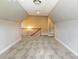 Spacious bonus room featuring neutral paint, gray carpet, and a wooden staircase railing at 6907 Hunts Mesa Dr, Fort Mill, SC 29707