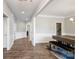 Bright dining area with hardwood floors, wainscoting, and an elegant chandelier, perfect for gatherings at 6907 Hunts Mesa Dr, Fort Mill, SC 29707