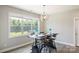 Bright dining room features a large window and unique industrial dining table at 6907 Hunts Mesa Dr, Fort Mill, SC 29707