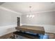 Inviting dining room featuring a large wooden table, cozy bench seating, and decorative wainscoting details at 6907 Hunts Mesa Dr, Fort Mill, SC 29707
