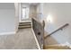 Spacious upstairs hallway with carpet and decorative railing leading to bedrooms at 6907 Hunts Mesa Dr, Fort Mill, SC 29707