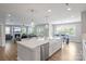 Open concept kitchen flows into the living room and dining areas at 6907 Hunts Mesa Dr, Fort Mill, SC 29707